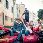 couple-sailing-on-venetian-gondola-2023-11-27-05-36-46-utc