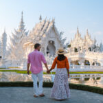 Couple visit the White Temple Chiang Rai Thailand, Wat Rong Khun Northern Thailand.