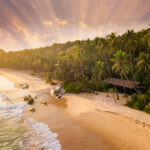 Sandy beach at sunset. Seychelles. Drone photo