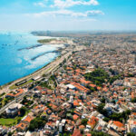 Aerial drone view of Istanbul, Turkey. Bosporus strait with multiple floating ships, sea port, multiple buildings