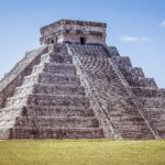 A closeup shot of Chichen Itza in Mexico under a clear blue sky
