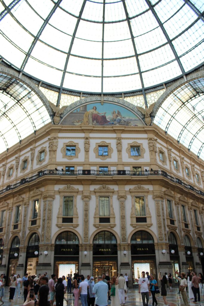 Stunning view of Galleria Vittorio Emanuele II's architecture in Milan, with a glass dome ceiling.