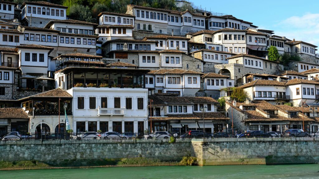 Scenic view of historic Ottoman houses in Berat, Albania, reflecting timeless architectural beauty.