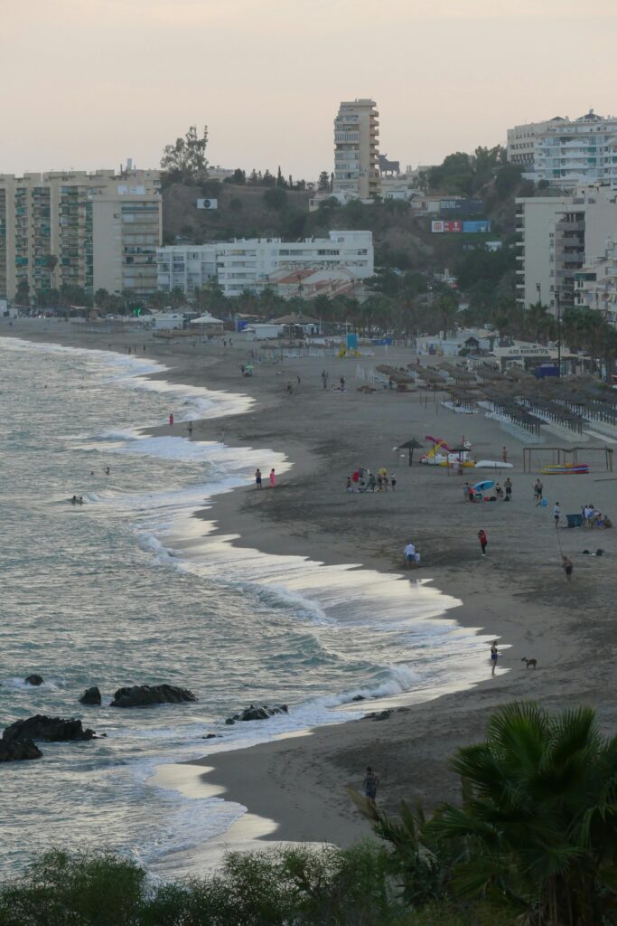 A beautiful coastline with waves and city skyline in Fuengirola, Spain.