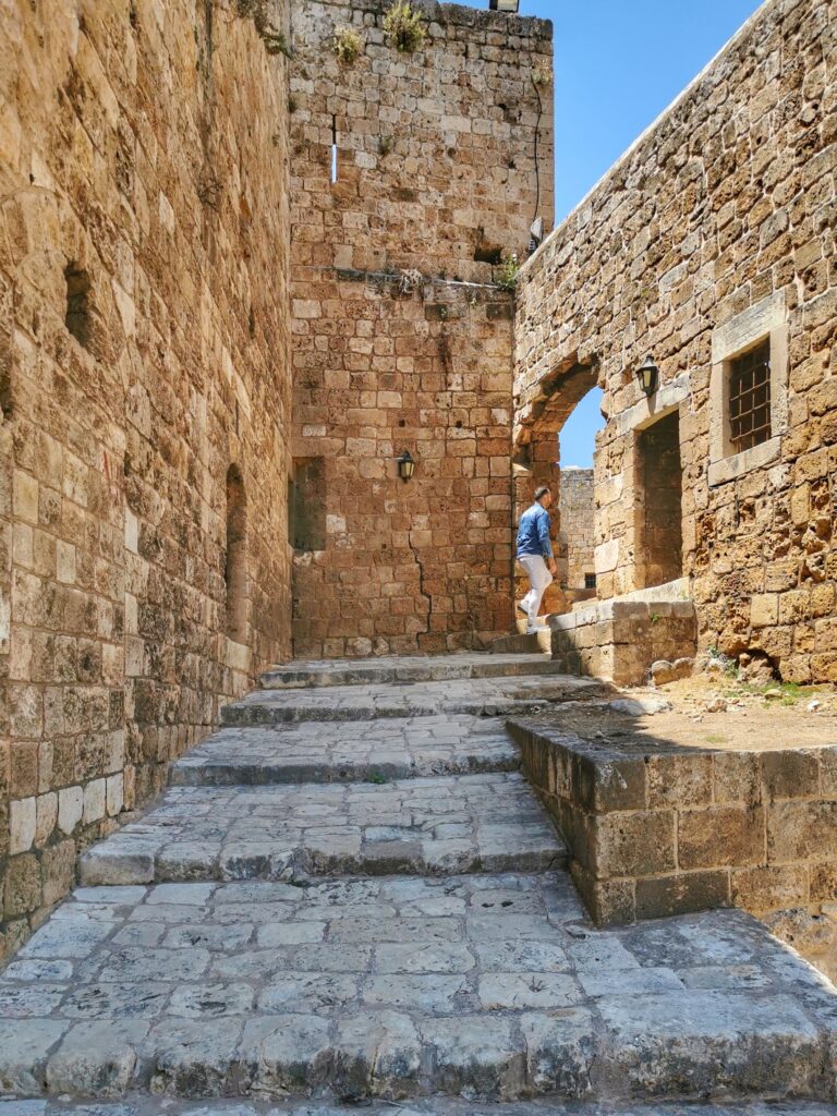 Explore ancient stone walls and arches in Tripoli's historic site.