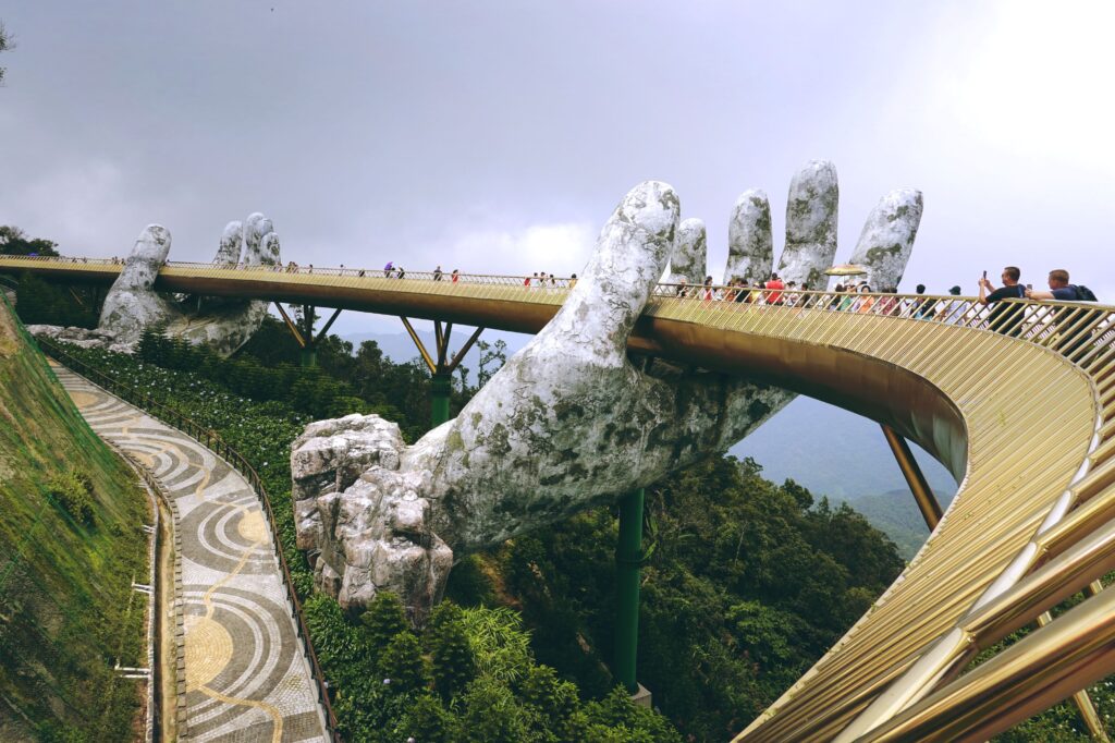 Golden Bridge in Da Nang, Vietnam with large sculpted hands supporting the structure.